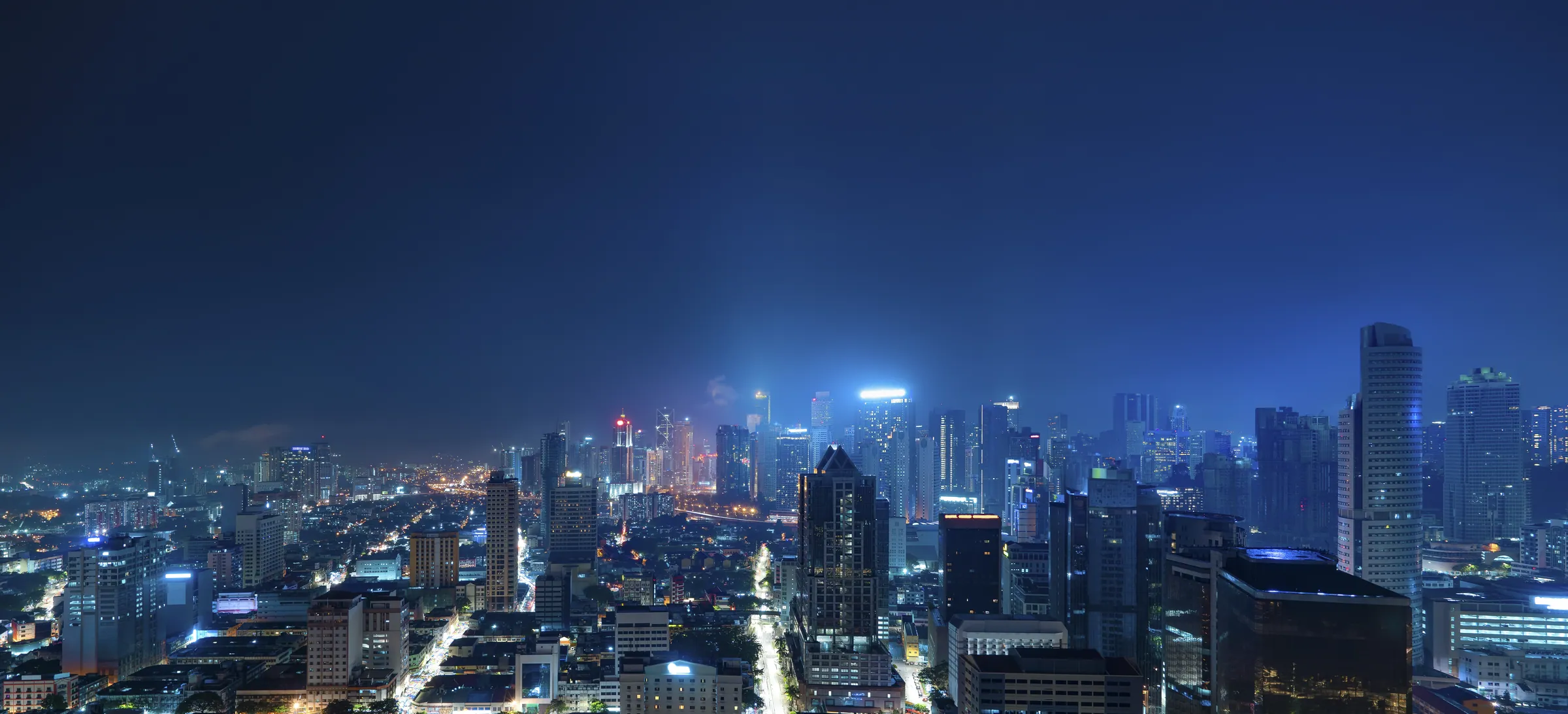 Aerial view of a city skyline at night